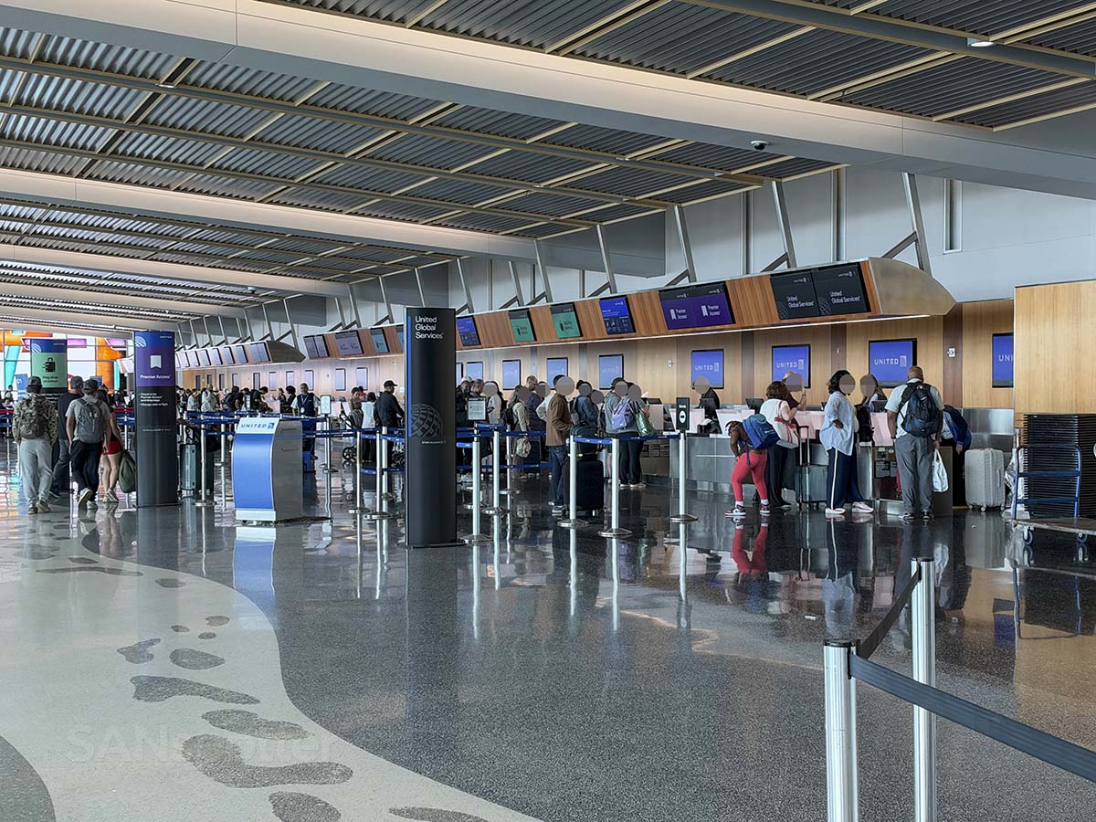 The line of people at the United Airlines check-in and baggage drop area mid morning on a Saturday San Diego airport terminal 2 west