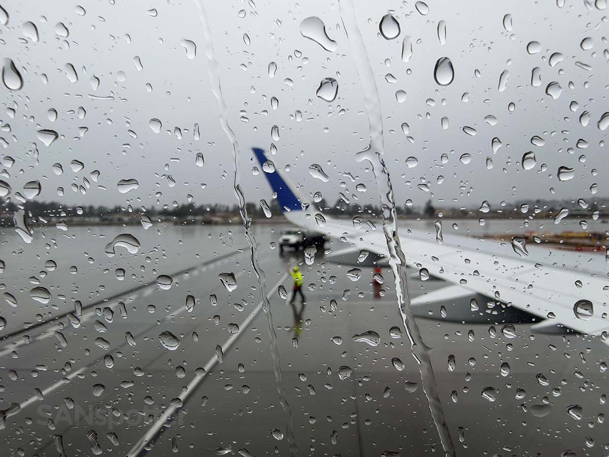 United Airlines A321XLR pushing back from gate 45 in the rain at the San Diego airport