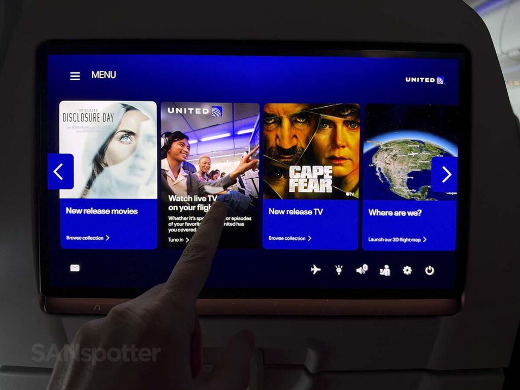 Scrolling through the main menu of the in flight entertainment system in United Airlines A321XLR economy