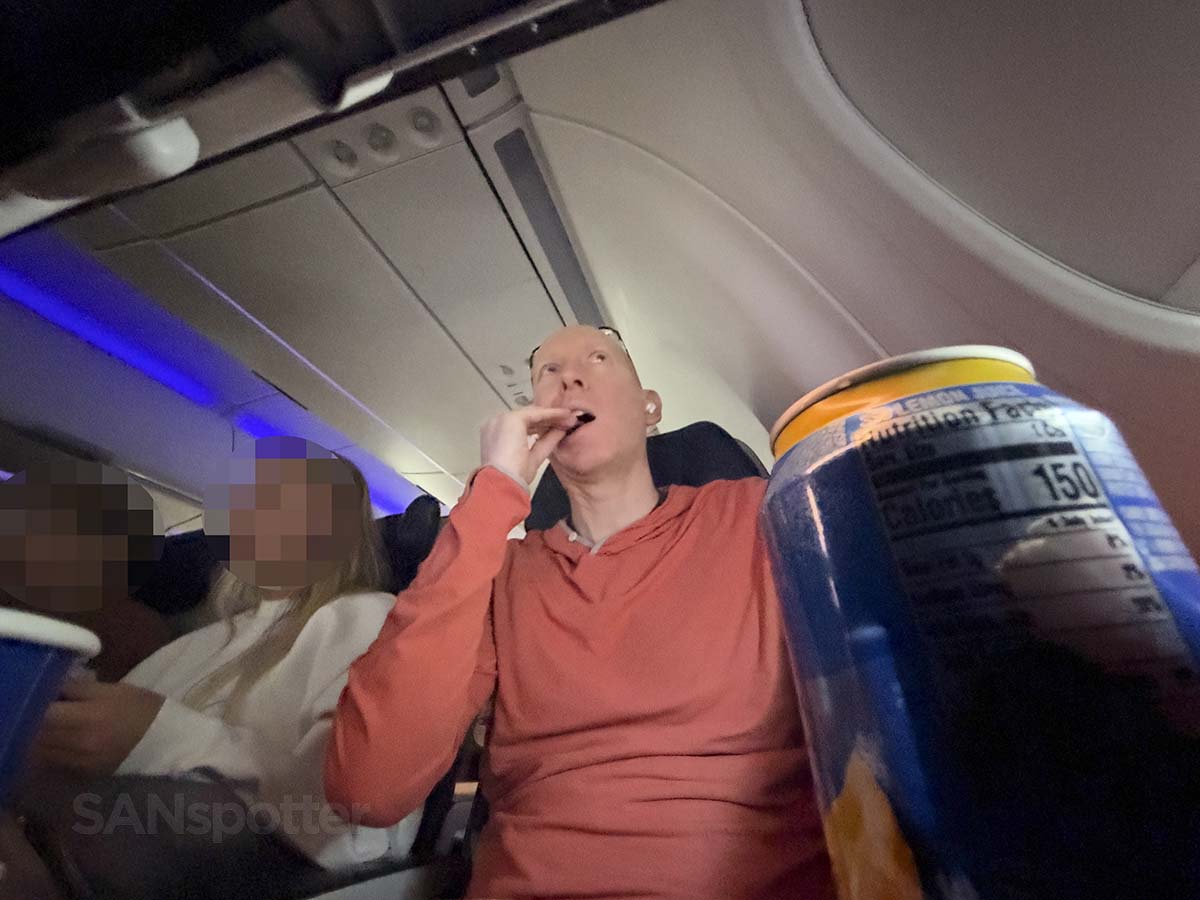 Scott Leazenby enjoying the complementary snack in United Airlines A321XLR economy