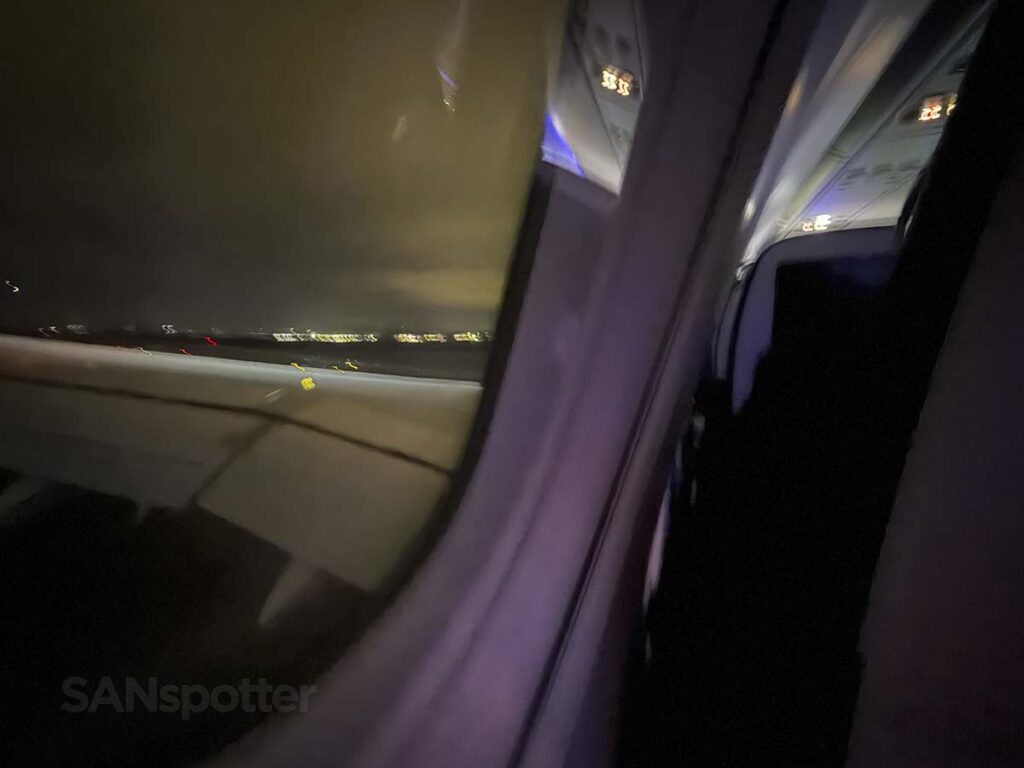 Looking out the window of a United Airlines A321XLR while on approach into IAD at night
